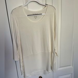 Cream top with sheer bottom.